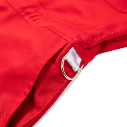 Close-up of a red Ren jumpsuit showing fabric texture and detailed stitching on the front.